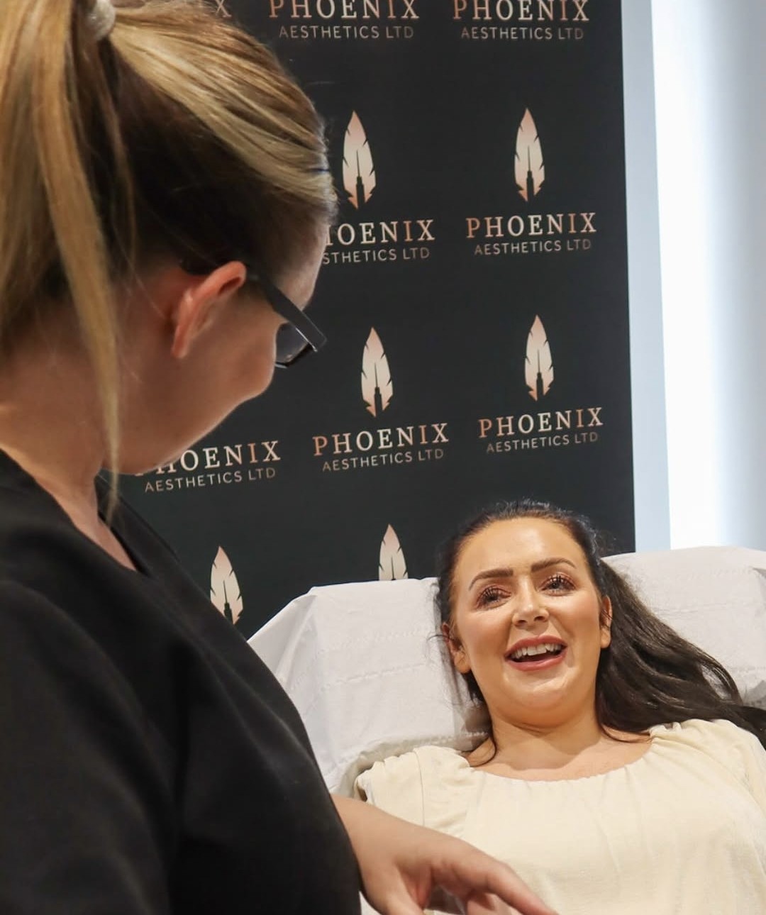 Hayley, Registered Nurse and aesthetics practitioner, with a client at Phoenix Aesthetics in Swansea